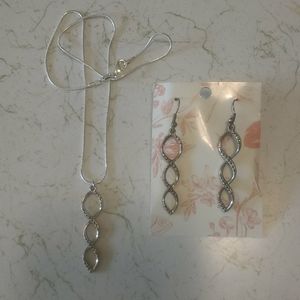 Matching silver pendant necklace and earrings